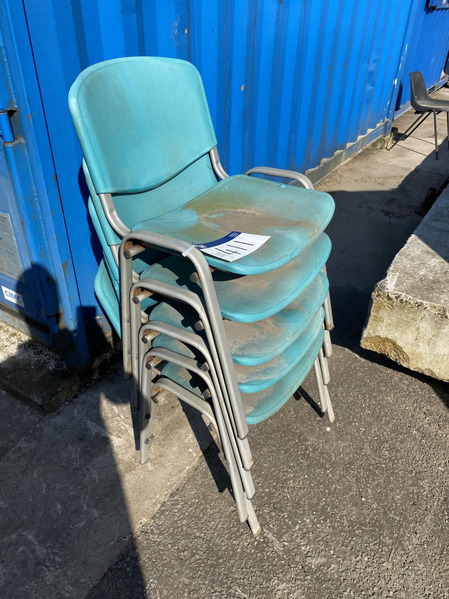 Five Plastic Stacking Chairs