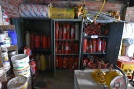 Three double door steel cabinets with contents, including fire extinguishers, and fire