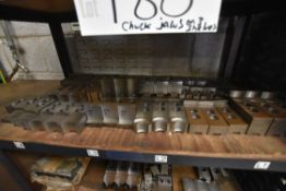 Mainly Chuck Jaws, on three shelves of steel rack