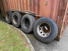 Four 305/75R 24.5 Tyres, as set out against container