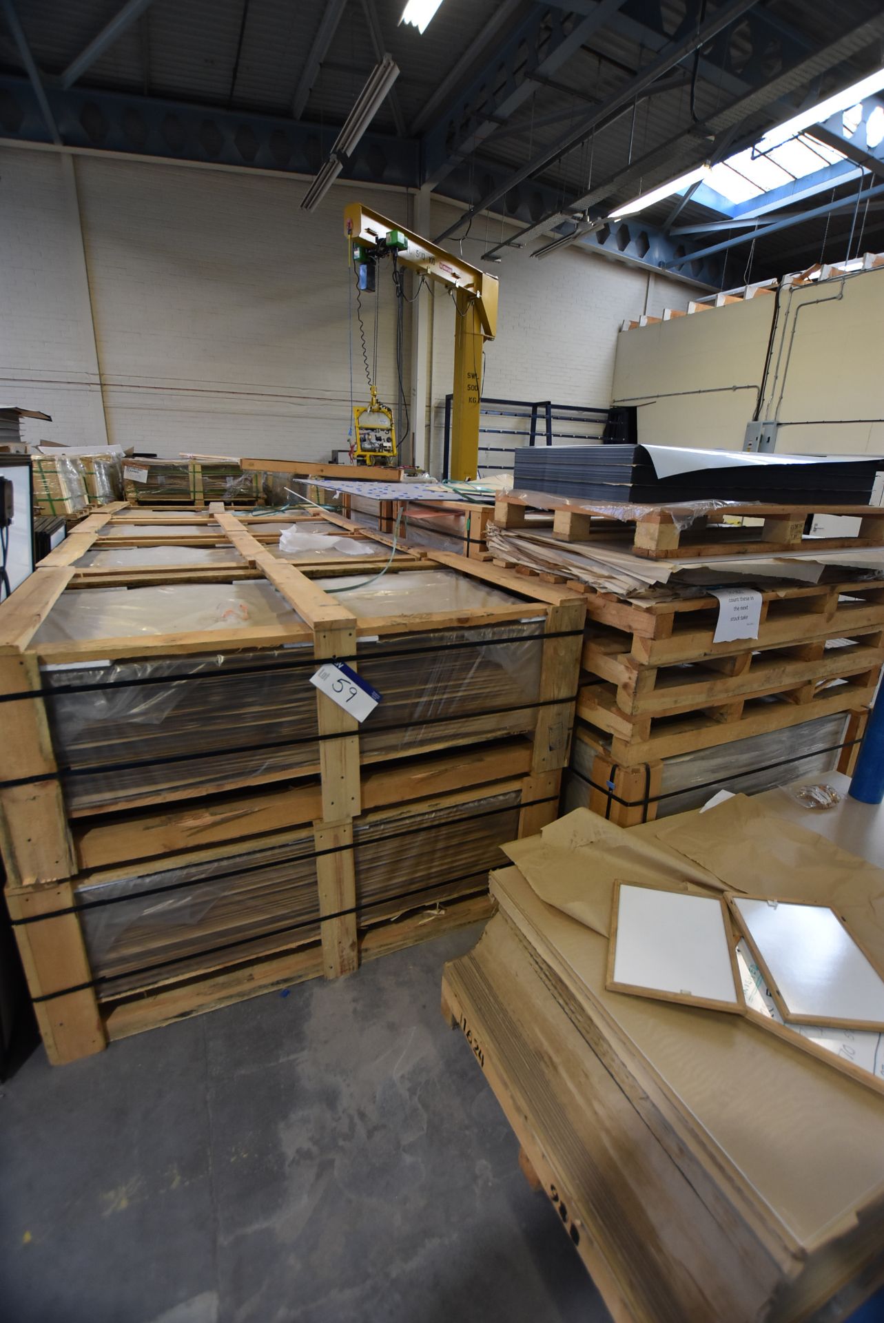 Assorted Cut-to-Size Glass Panels, stacked in timber crates in one area, understood to include