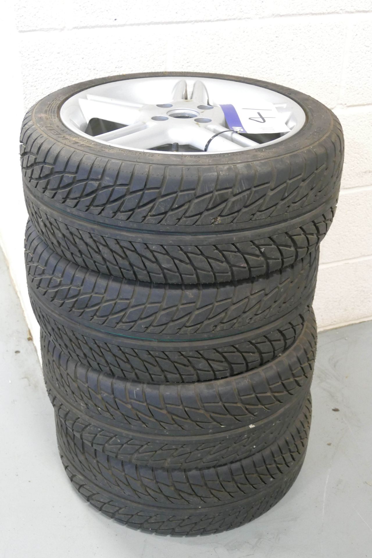 Four 205/45R16-83 Tyres, with alloy rims (understood to fit Ford Escort)