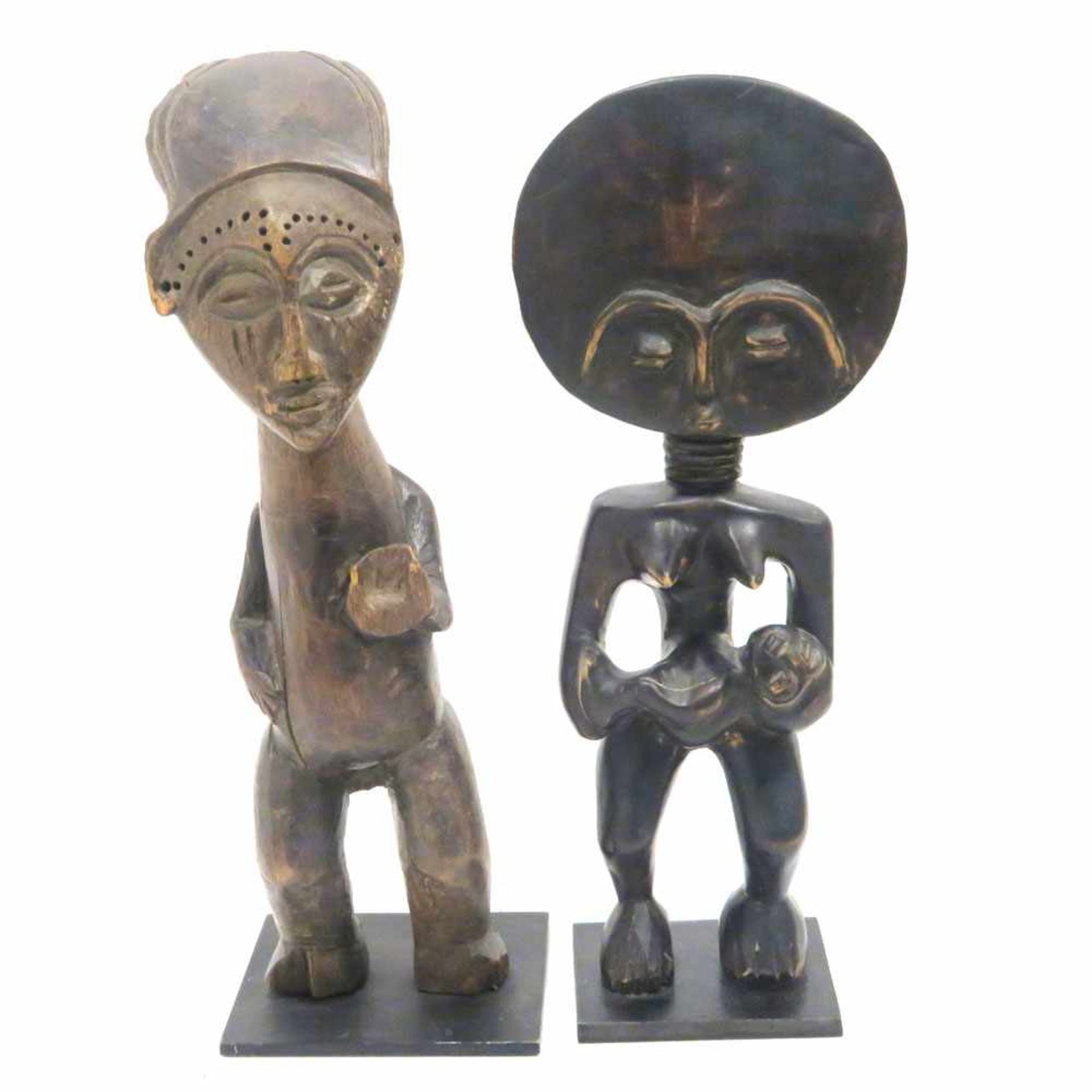 Mutter mit Kind / Stehende FigurU.a. Asante, Ghana. Holz, geschnitzt, tlw. geschwärzt. Jeweils auf