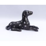 Figure of a resting dog