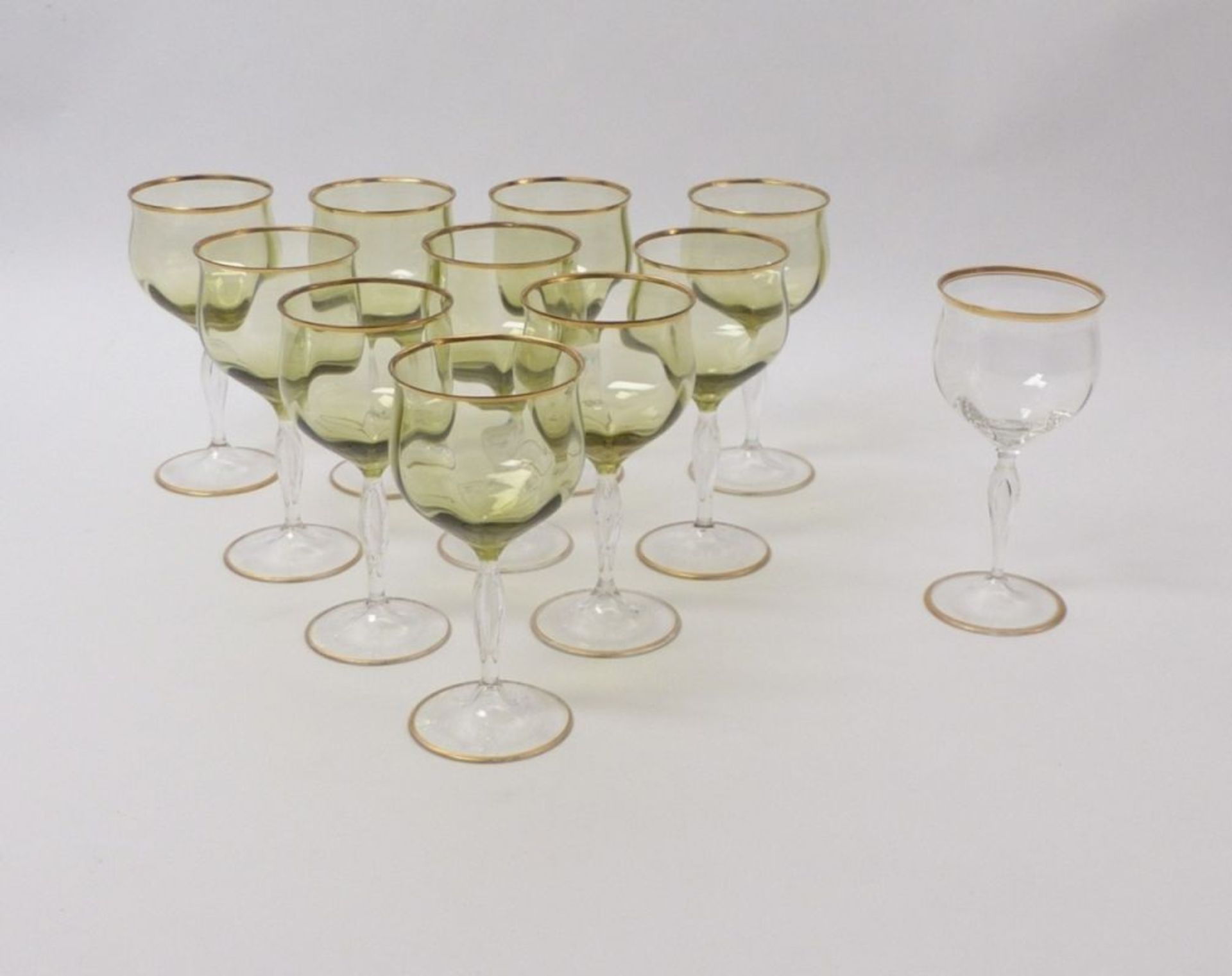 Eleven wine or aperitif glasses