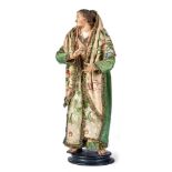 Neapolitanische Krippenfigur - OrientalinEnde 18. Jh.Auf runder Standplatte junge Frau in reich