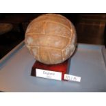 A leather football bearing numerous autographs of an England squad circa 1962, including Bobby