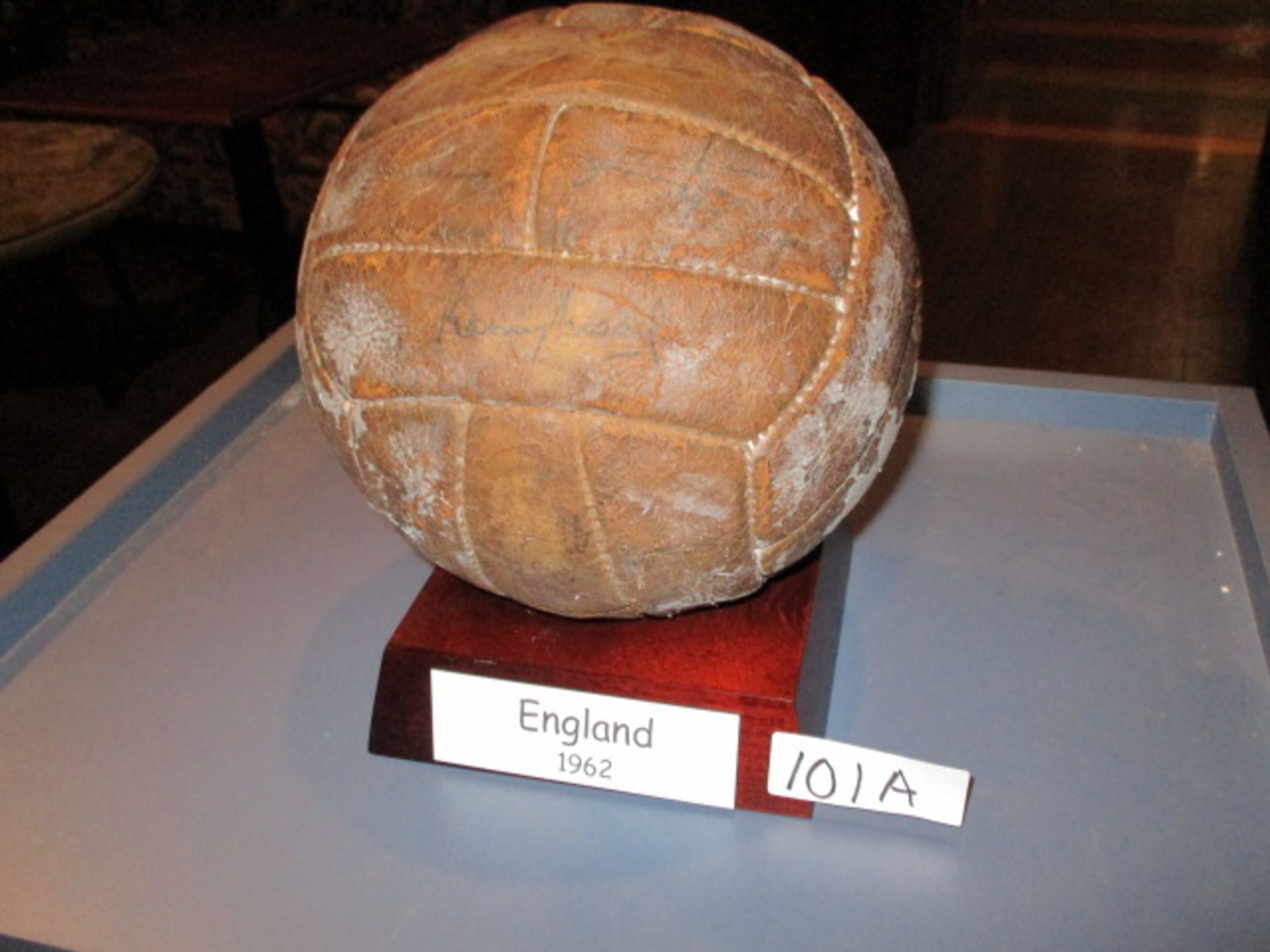 A leather football bearing numerous autographs of an England squad circa 1962, including Bobby