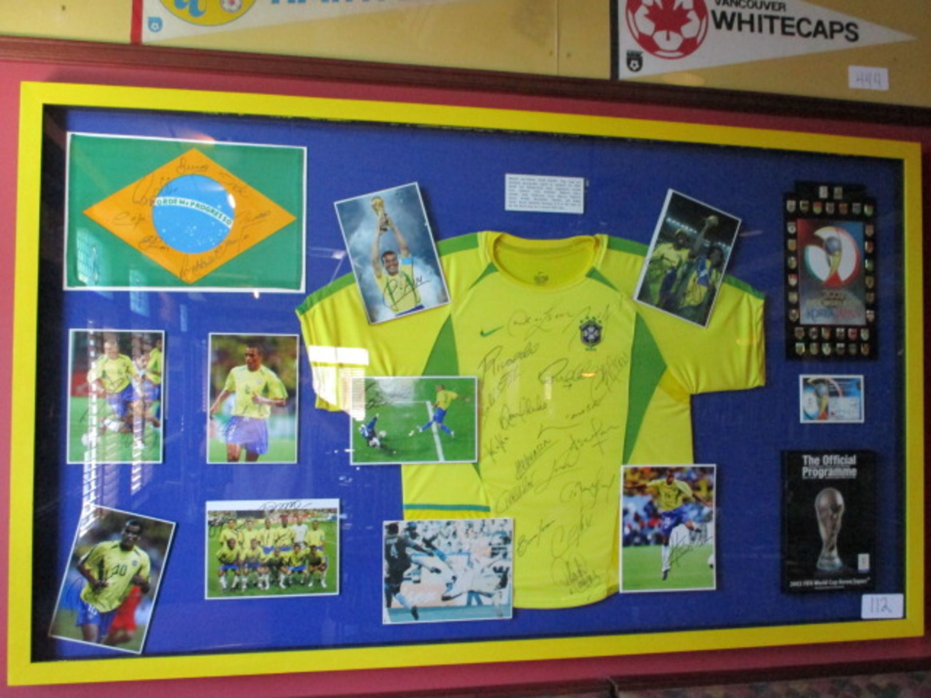 Brazil National team shirt, flag, team and individual photos signed by members of the 2002 World Cup