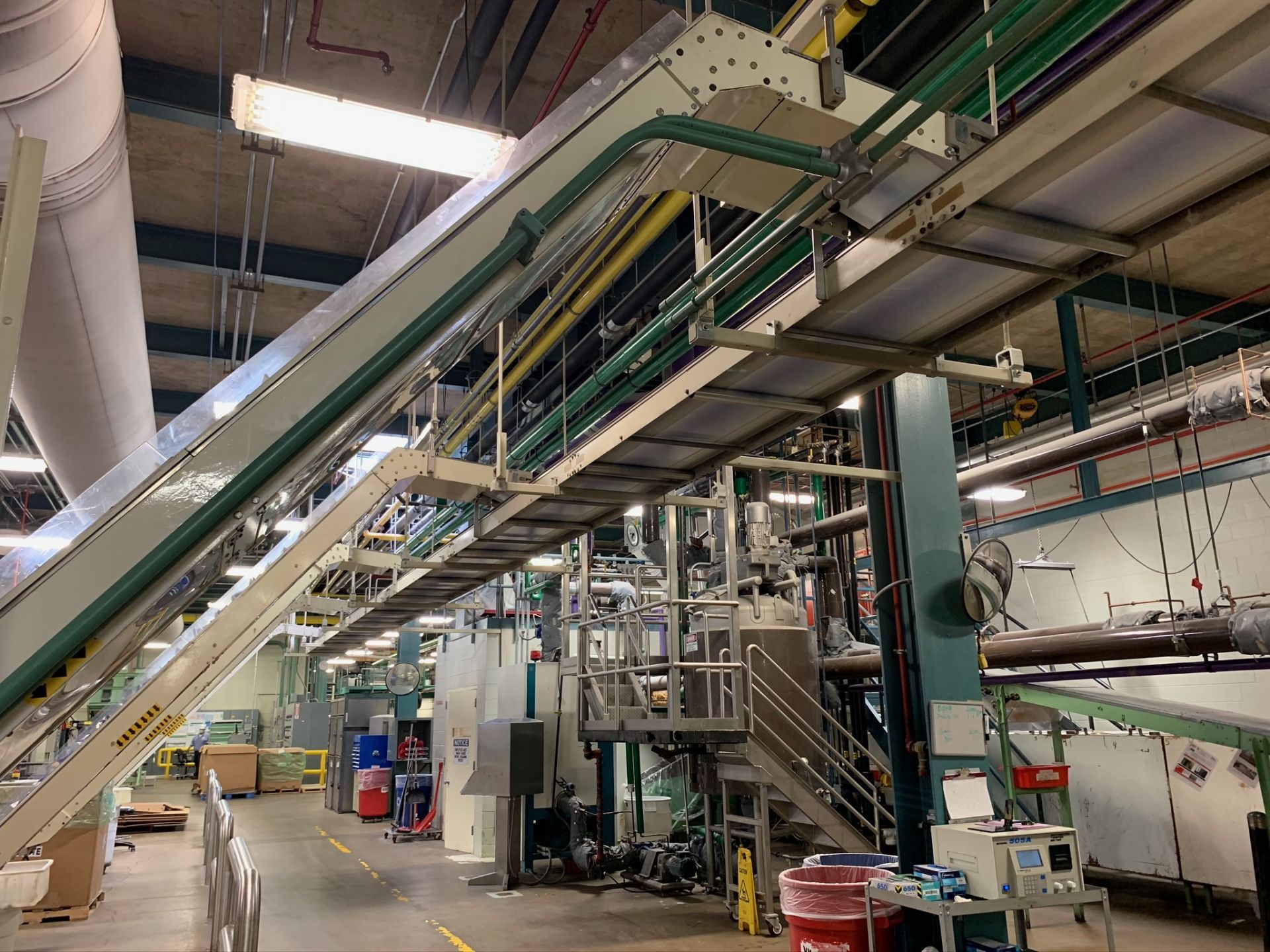 (Located in Burlington WI) Overhead Feeding Conveyor System to Storveyor. RIGGING FEE: $8800