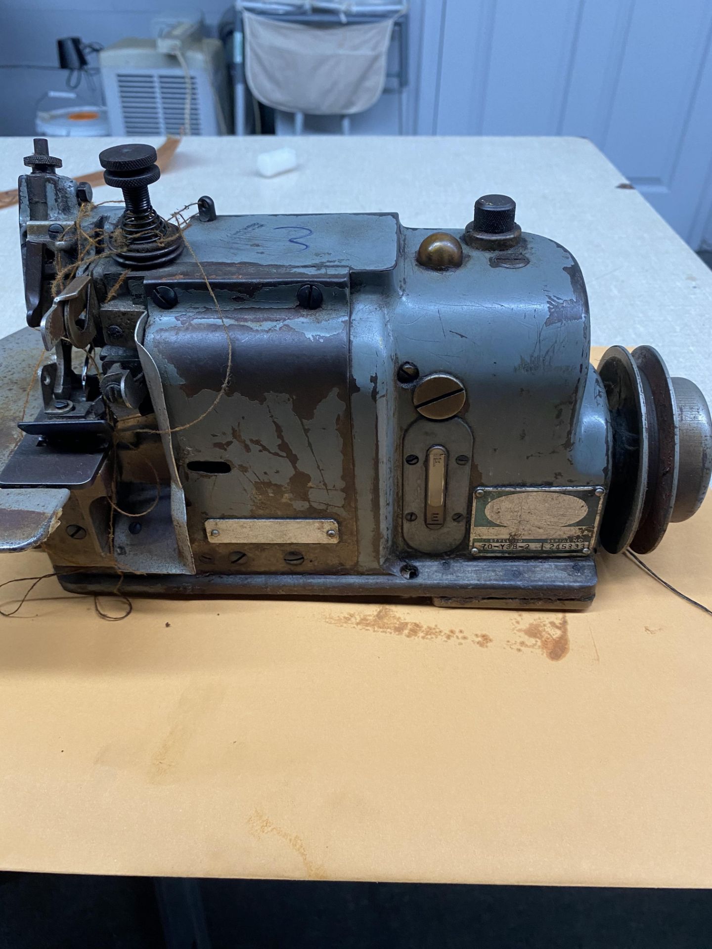 Merrow Sewing Machine, Model M3DW-2, mounted on a stand / table. RIGGING FEE $25 - Packaging not