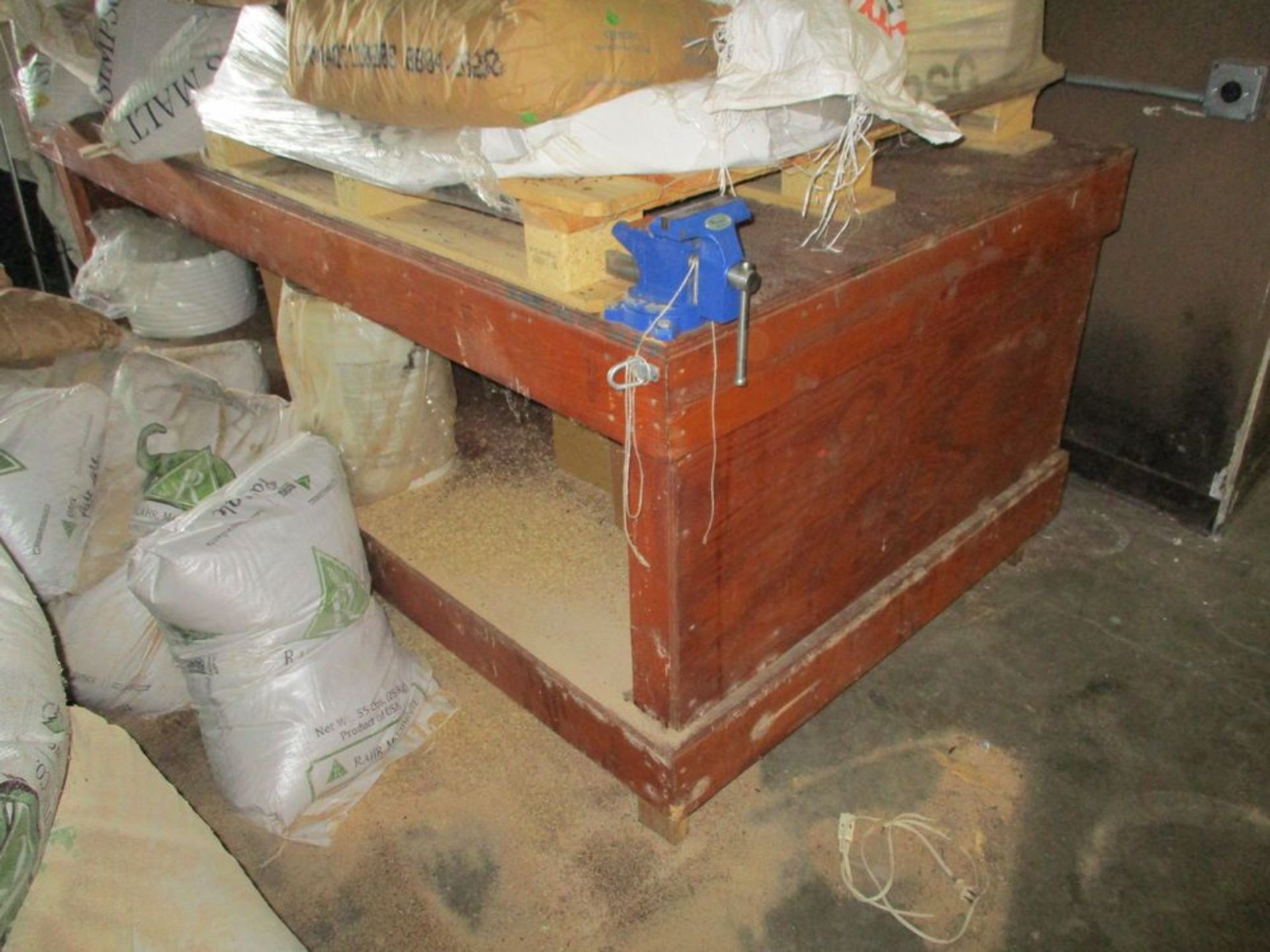 Wood construction work bench with vise, 8 ft x 4 ft x 37 in hgt ***Auctioneer Note*** -- $75 Removal