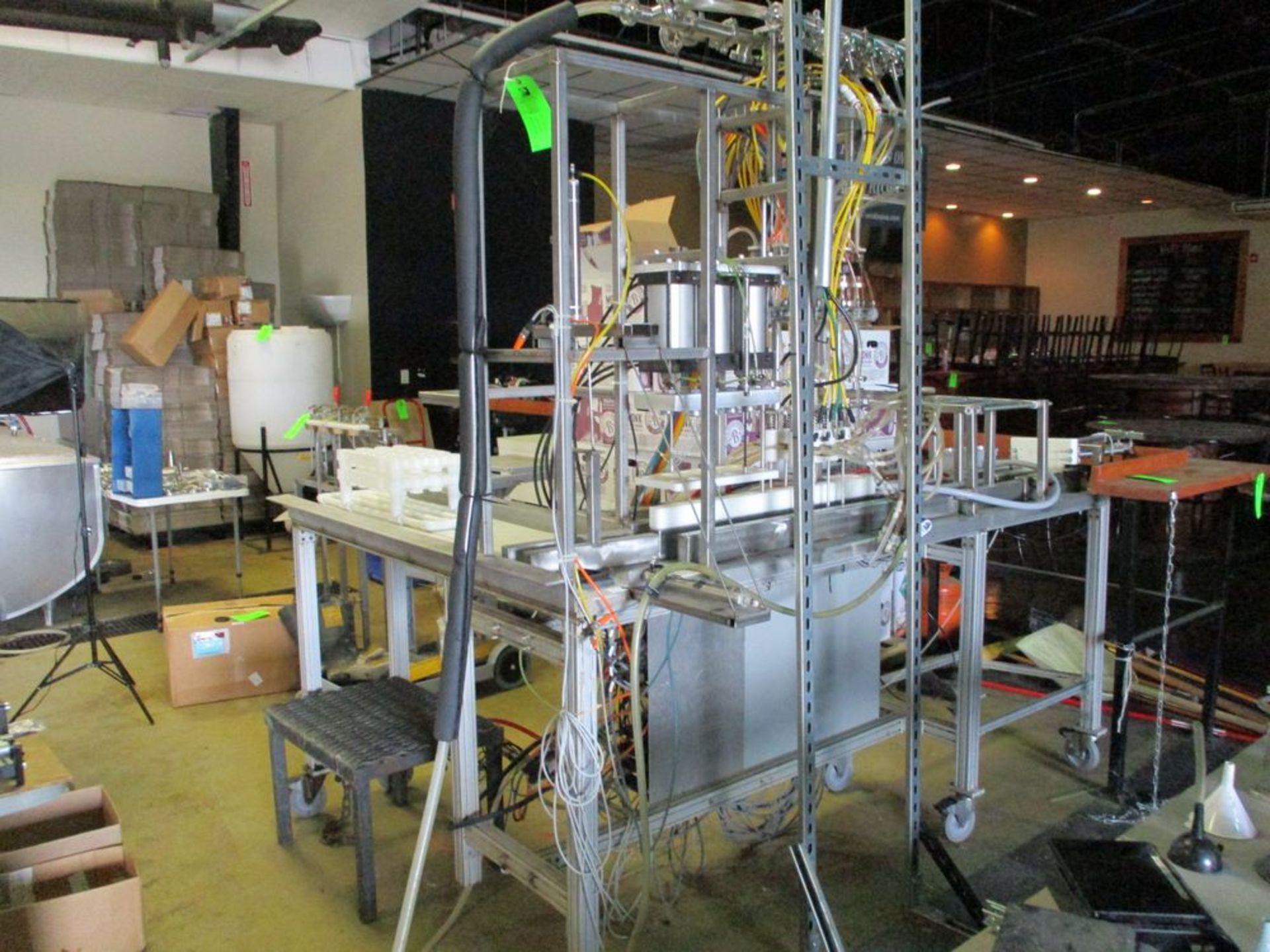 Semi-automatic 6 station bottle filler with spare parts, 112 in x 74 in ***Auctioneer Note*** -- $