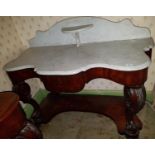 A 19th Century Mahogany Wash Stand with white marble top, platform base and cabriole supports.