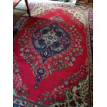 A Red Ground Tabriz Carpet with multi borders. 304 x 202cm.