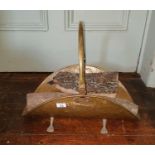 A brass log Bucket with with hairy paw feet along with a cast iron Companion Set.