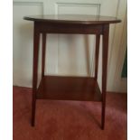 An Edwardian Mahogany and Inlaid Oval Side Table. 56 L x 40 D x 70 H cm.