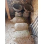 Two Milk Churns and Sieves along with three glass Milk Parlour Bottles.