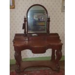A 19th Century Mahogany Dressing Table with arch top mirror, platform base and cabriole supports