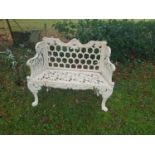 A Cast Iron Bench with horseshoe effect back.