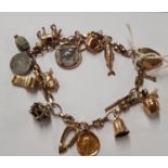 A 9 Carat Gold Charm Bracelet with approx six 9 Carat Gold Charms.