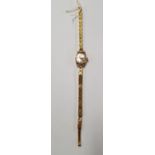 An 18 Carat Gold Ladies Watch.