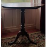 A Georgian Mahogany Pad Foot Supper Table. 59cm diameter.