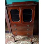 An Edwardian Mahogany Display Cabinet with three graduated drawers W 69 x H123 x D43 cms.