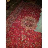 A Red Ground Persian Carpet. 190 x 297cm.