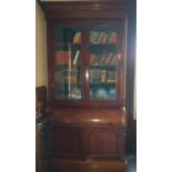 A magnificent early Victorian Mahogany Cylinder Bureau Bookcase with glazed top doors and panelled