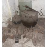 A large quantity of cast iron Items under stairs.