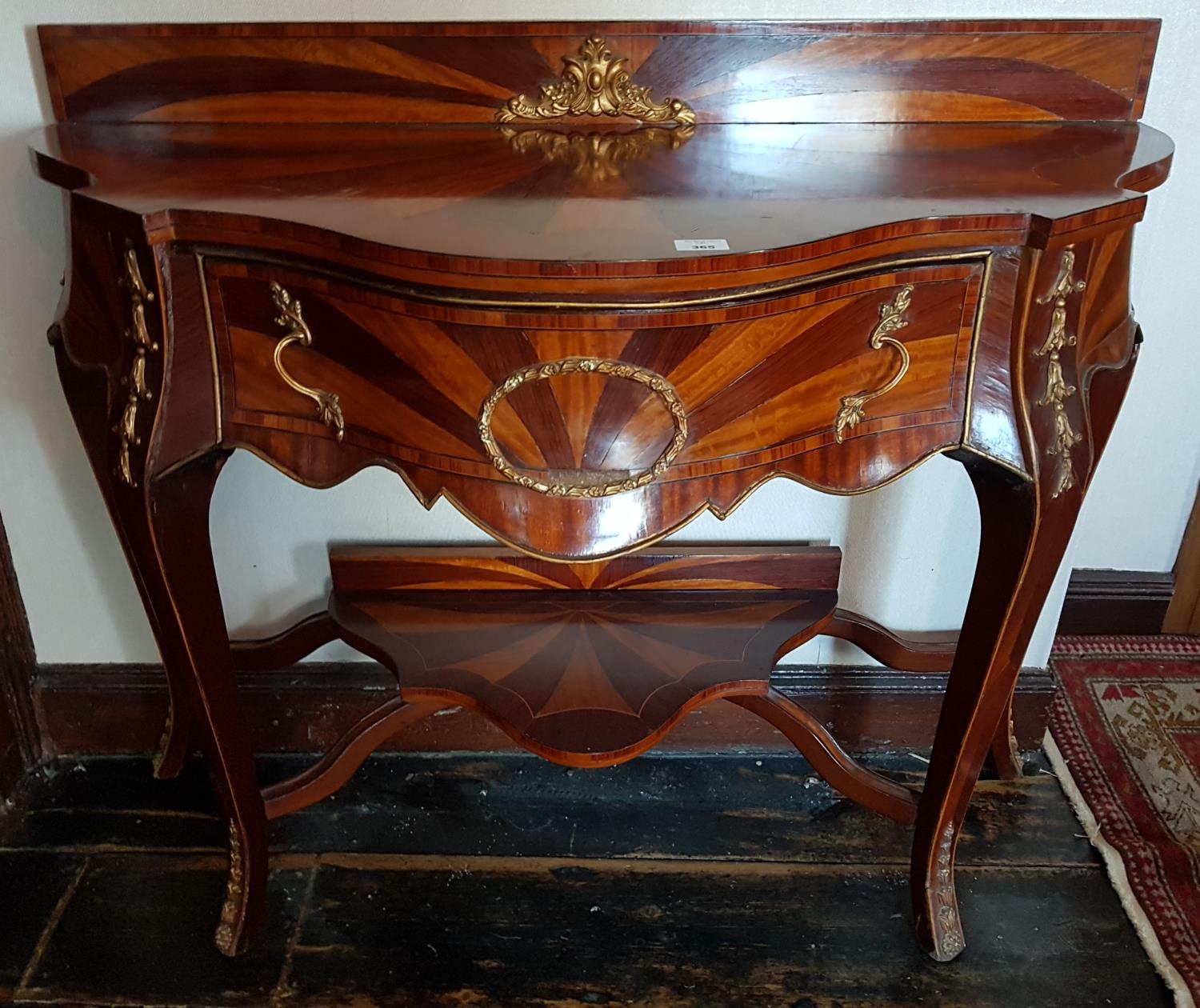 A fantastic Mahogany, Rosewood and Satinwood Continental Side Table with ormolu mounts.