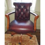 A modern Burgundy Office Chair with deep buttoned back.