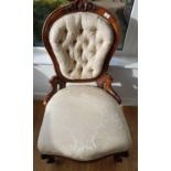 A 19th Century Mahogany show frame Ladies Chair with cream deep buttoned upholstery.