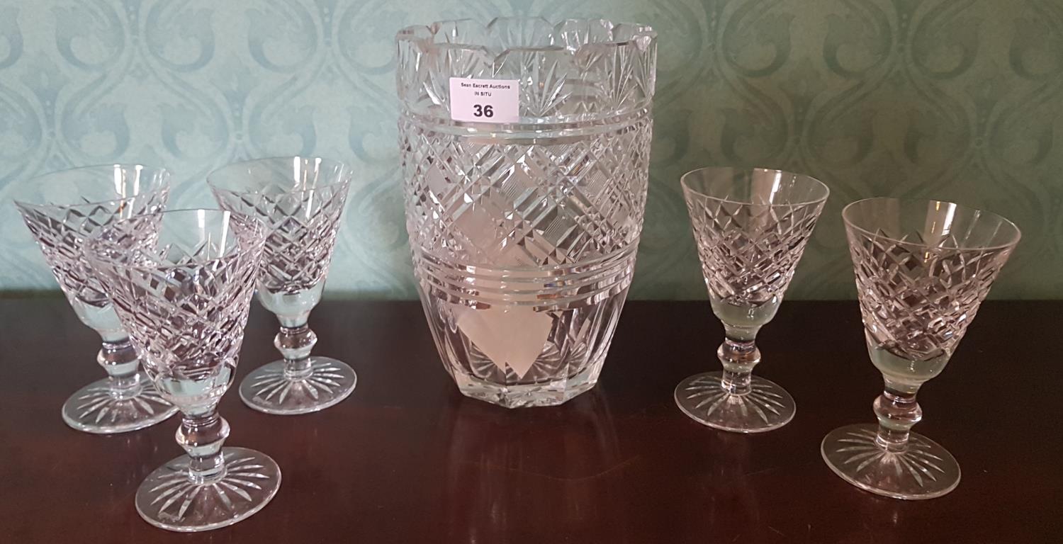 A large Waterford Crystal Vase along with five Waterford Crystal Glasses.