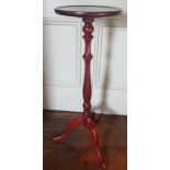 A Mahogany Torchere. 87 cms high.