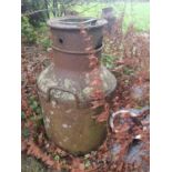 A Metal Milk Churn.