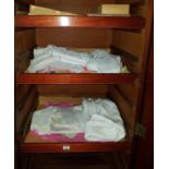 A quantity of Linen and Lace in right hand side of wardrobe.