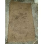 A small Belfast Sink along with a large back door mat.