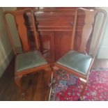 A set of four Queen Ann Style Dining Chairs.