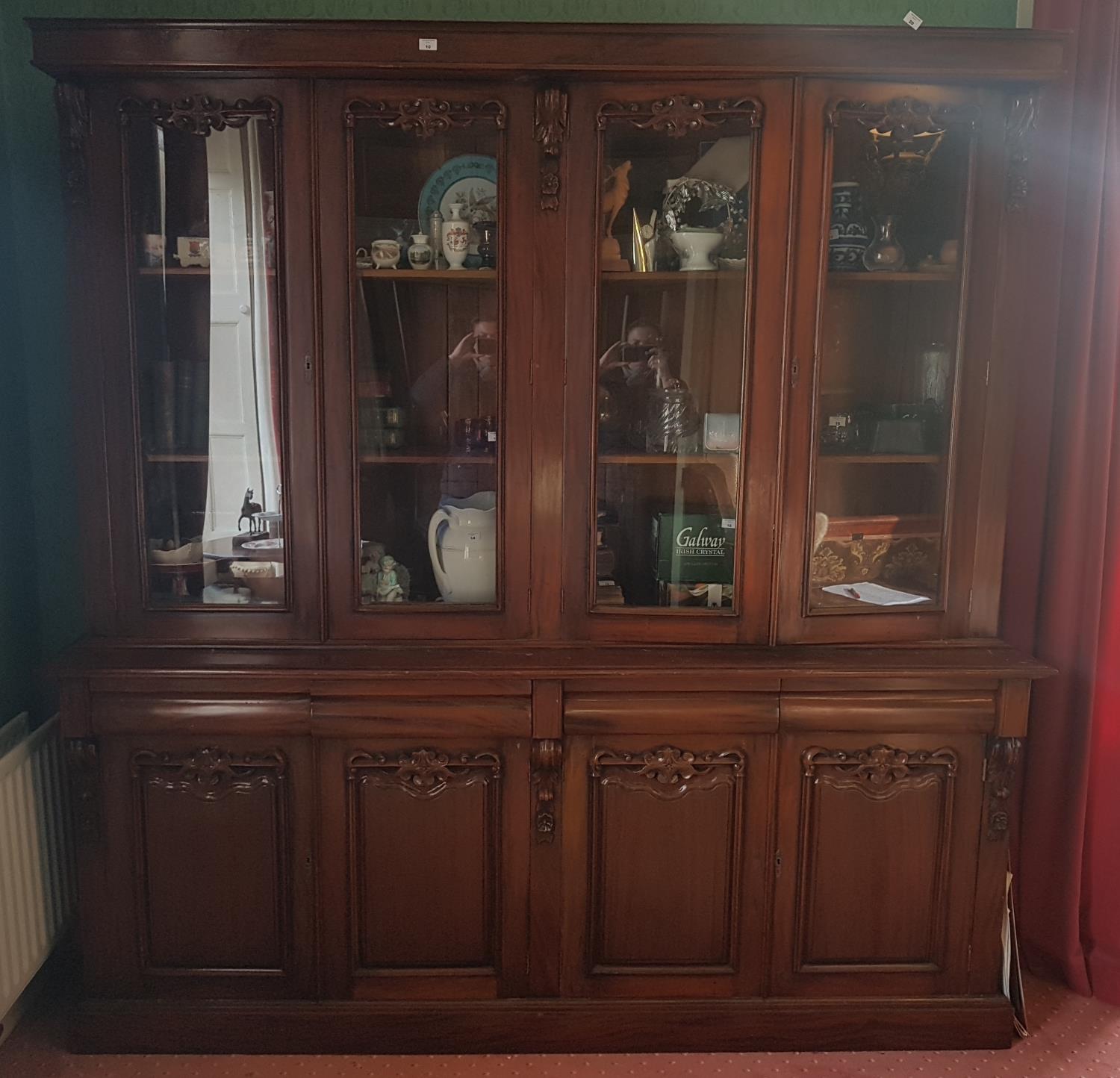 A very large Mahogany four door Bookcase with a glazed top and panelled door base. 212 L x 216 H x