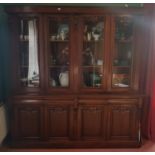 A very large Mahogany four door Bookcase with a glazed top and panelled door base. 212 L x 216 H x
