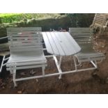 A White Metal and Timber Chair and Table combo on wheels.