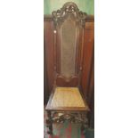 A 19th Century Walnut Hall Chair with cane seat and back.