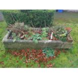 A large stone Trough.