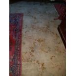A very large Hand Stitched Carpet with Cream and Green Ground and all over decoration 620 x 370 cms.