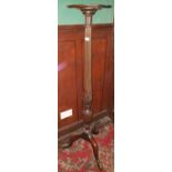 A 19th Century Mahogany Reeded Torchere on a tripod base 23 x 15 cms.