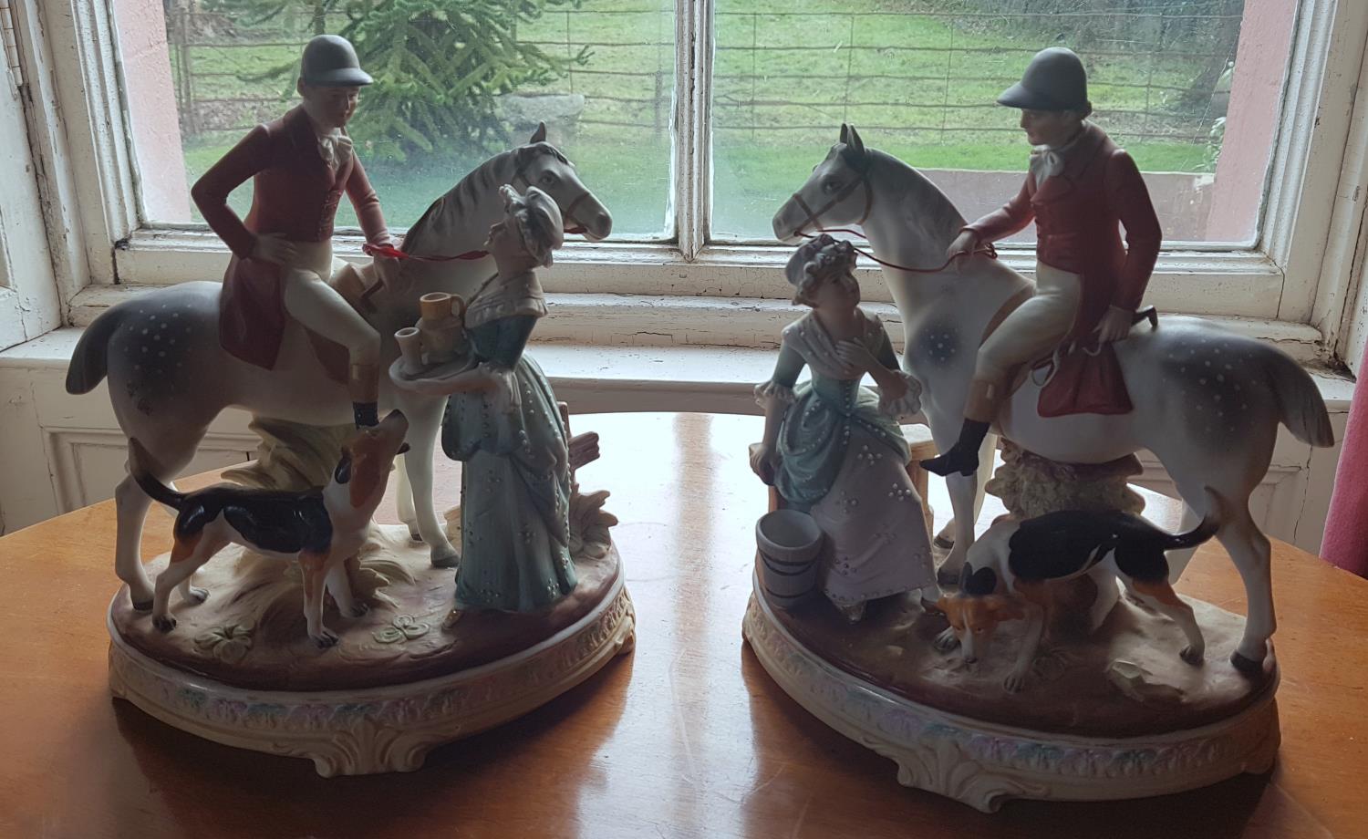 A pair of Porcelain Hunting Figures.