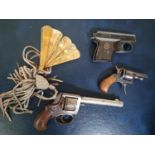 Three vintage Starting Pistols along with a Fan.