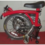 A Brompton Foldup Bike. As new with three gears.